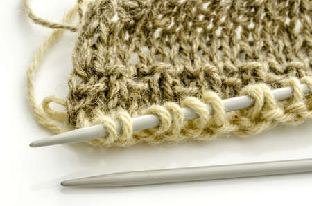Closeup of knitting, isolated on a white background の写真素材