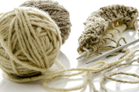 Pattern of knitting with grey ball of woollen thread and needles  Isolated on a white background の写真素材
