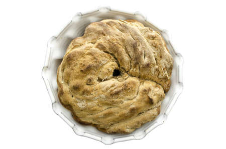 Top view of a homemade bread in a baking pan isolated on a white background の写真素材