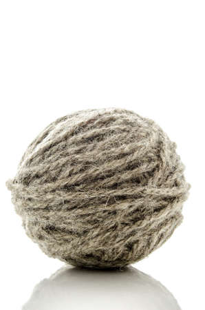 Grey ball of woolen thread for knitting, isolated on a white background の写真素材