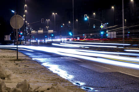Night traffic lights on a crossroad in European city Ljubljana の写真素材