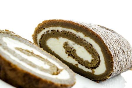Delicious homemade roulade with cream isolated on a white background の写真素材