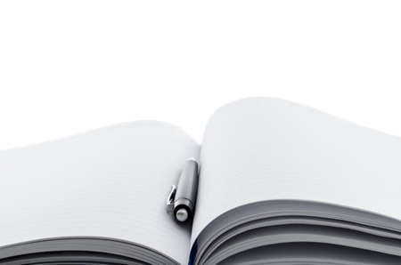 Black ballpoint pen and an open notebook with copyspace 