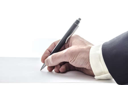 Hand of a man in suit writing on a blank paper, with copyspace の写真素材