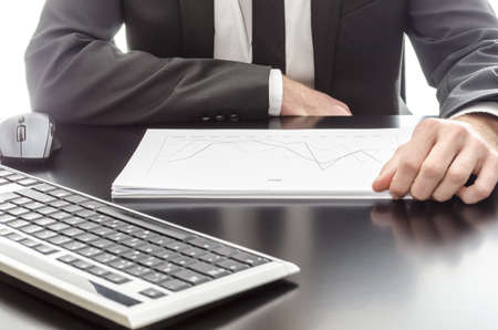 Businessman analyzing graph document の写真素材
