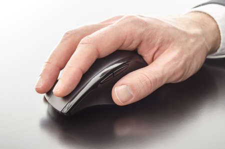 Male hand using a computer mouse 
