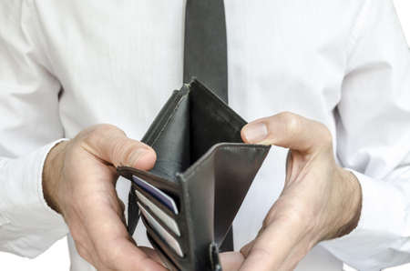 Man in white shirt and black tie holding an empty wallet の写真素材