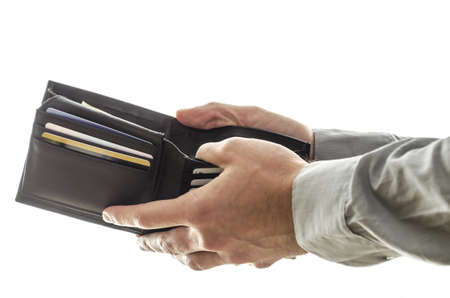 A man opening his  wallet to pay for something の写真素材