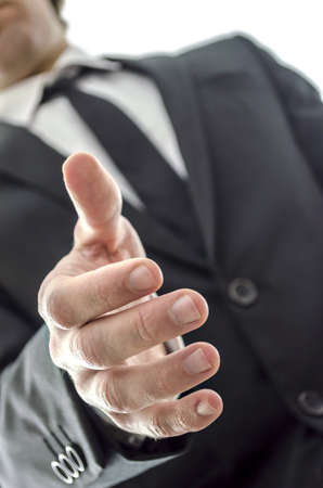 Closeup of a businessman offering a handshake の写真素材