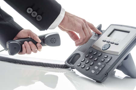 Closeup of a business man hanging up the phone の写真素材