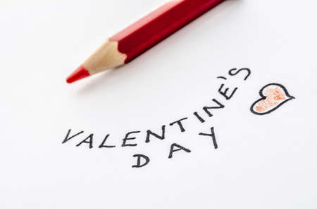 Handwritten Valentines day message and a red pencil on a white paper の写真素材