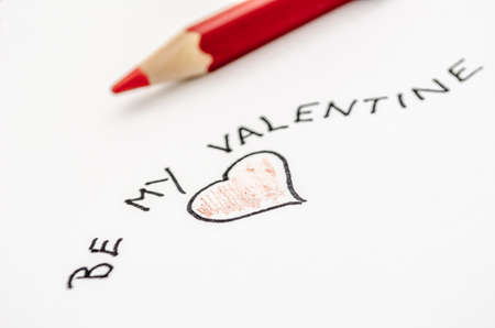 Handwritten Valentine message with a heart on a white paper の写真素材
