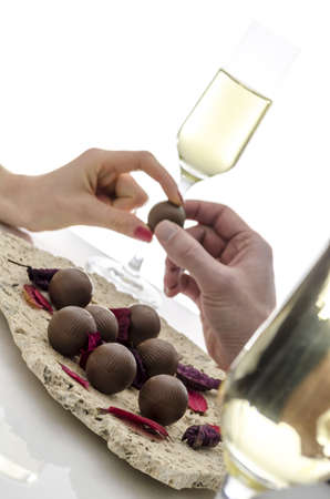 Cropped view of a couple sharing a chocolate candy の写真素材