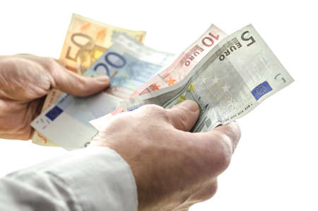 Man couting money banknotes  Isolated over white background の写真素材