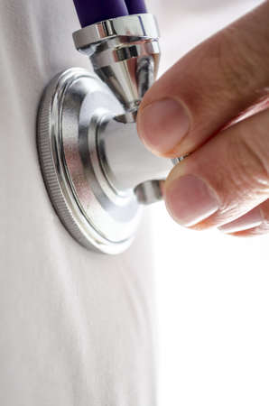 Closeup photo of examining the patient with stethoscope の写真素材