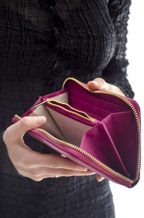 Woman in a black dress holding an empty wallet の写真素材