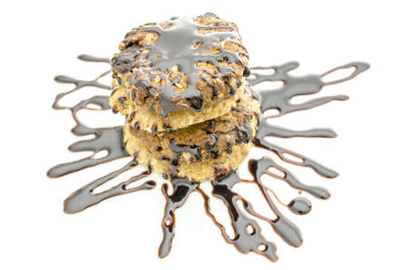 Stack of  cookies decorated with chocolate  Isolated over white background の写真素材