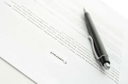 Business document and a pen. Focus on a contract sign.の写真素材