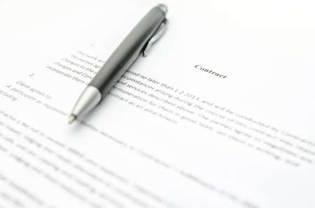 Closeup of a contract and a pen  Focus on a contract sign の写真素材