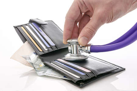 Checking open wallet with stethoscope  Concept of financial crisis の写真素材
