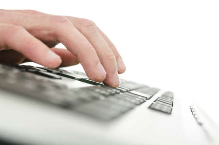 Closeup of young male hand typing on computer keyboard  Shallow dof 