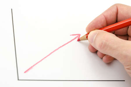 Hand drawing growing business graph with red arrow.の写真素材