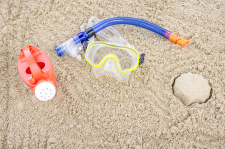 Diving mask on a sandy beach の写真素材