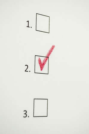 Red tick in a box of one of three options  