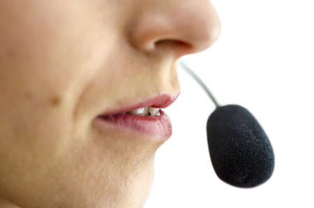 Detail of mouth and microphone of female customer service representative.の写真素材