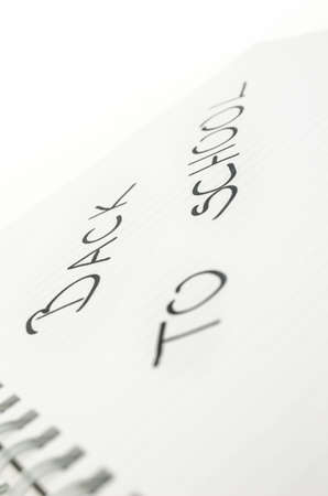 Closeup of phrase Back to school written in notebook.