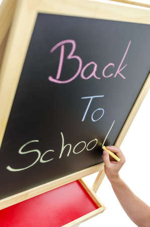 Writing Back to school with various colors on blackboard.