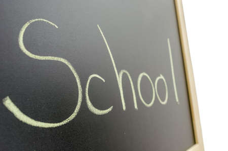 Word school written on blackboard. Education concept.