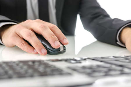 Closeup of businessman using office computer.