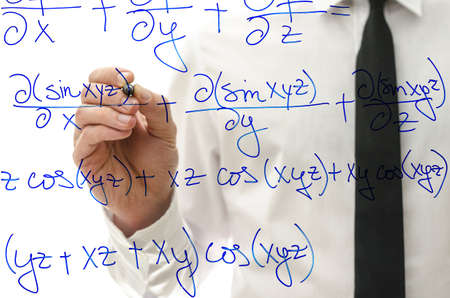 College teacher writing complicated mathematical equation on virtual whiteboard.の写真素材