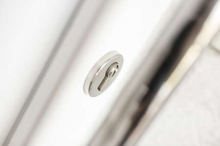 Closeup of front door and lock. Safety concept.