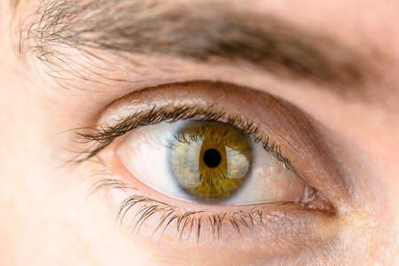 Studio macro shot of mans eye.の写真素材
