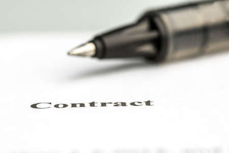 Macro shot of pen lying on business contract.の写真素材