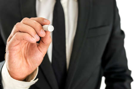 Closeup of businessman writing on virtual screen. Ready for your text.の写真素材