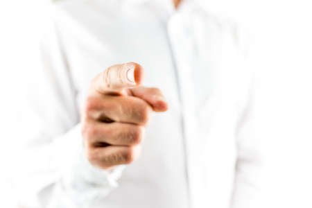 Closeup of male hand pointing finger at you.の写真素材