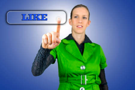 Young woman pressing Like button on virtual screen.