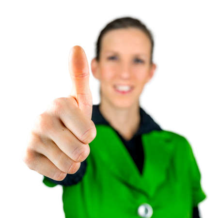 Young woman making thumbs up sign. Isolated over white background.の写真素材