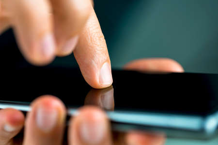 Closeup of using modern mobile phone.の写真素材