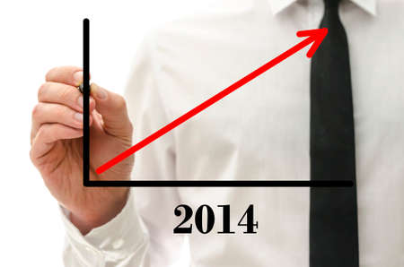 Closeup of businessman drawing growing financial graph for year 2014 の写真素材