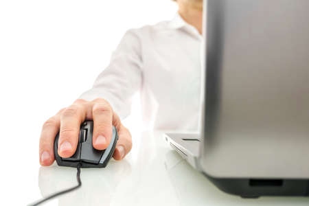Front view of businessman working on laptop computer.の写真素材