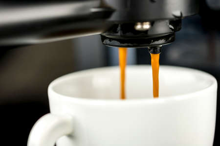 Closeup of coffee machine making espresso.の写真素材