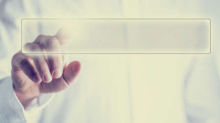 Retro image of a navigation bar on a virtual screen or computer interface with a man activating the button from behind, empty space ready for your text.の写真素材