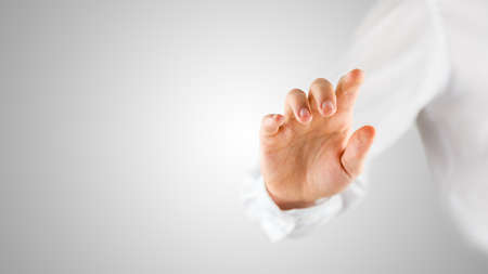 Male hand navigating in blank virtual screen with empty space ready for your text, product or banner.の写真素材