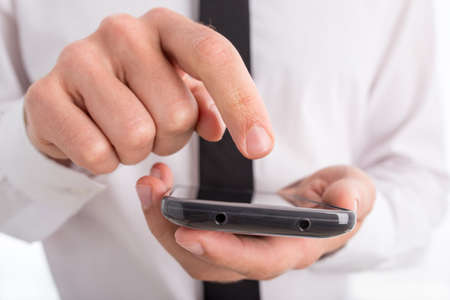 Close Up of Businessman Using Touch Screen Smartphone.