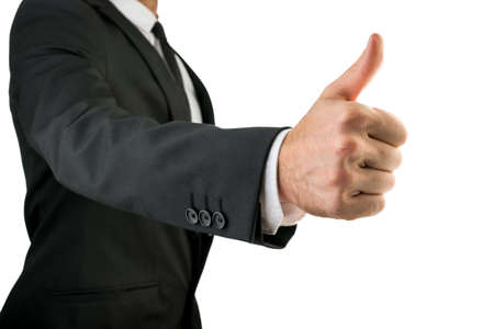 Businessman in Black Suit Showing Thumbs Up Sign, Emphasizing Approval or Satisfaction. Isolated on White Background.の写真素材