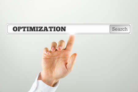 Businessman Pressing Optimization Text on Search Bar. Over Grey Background.